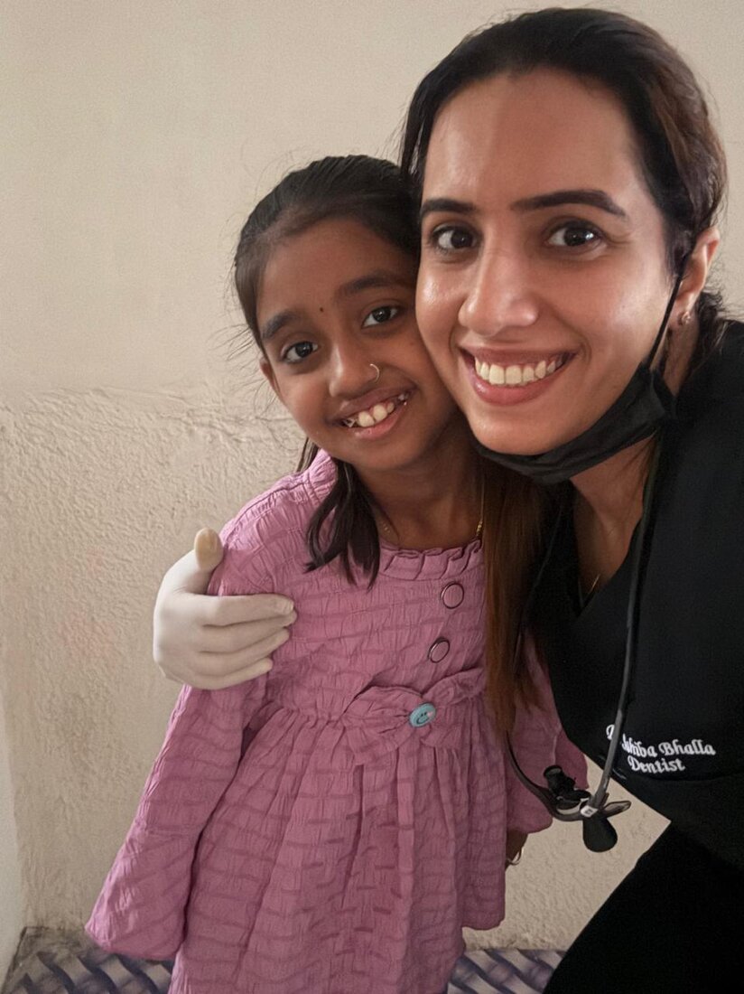 Dr. Sahiba with a happy young patient