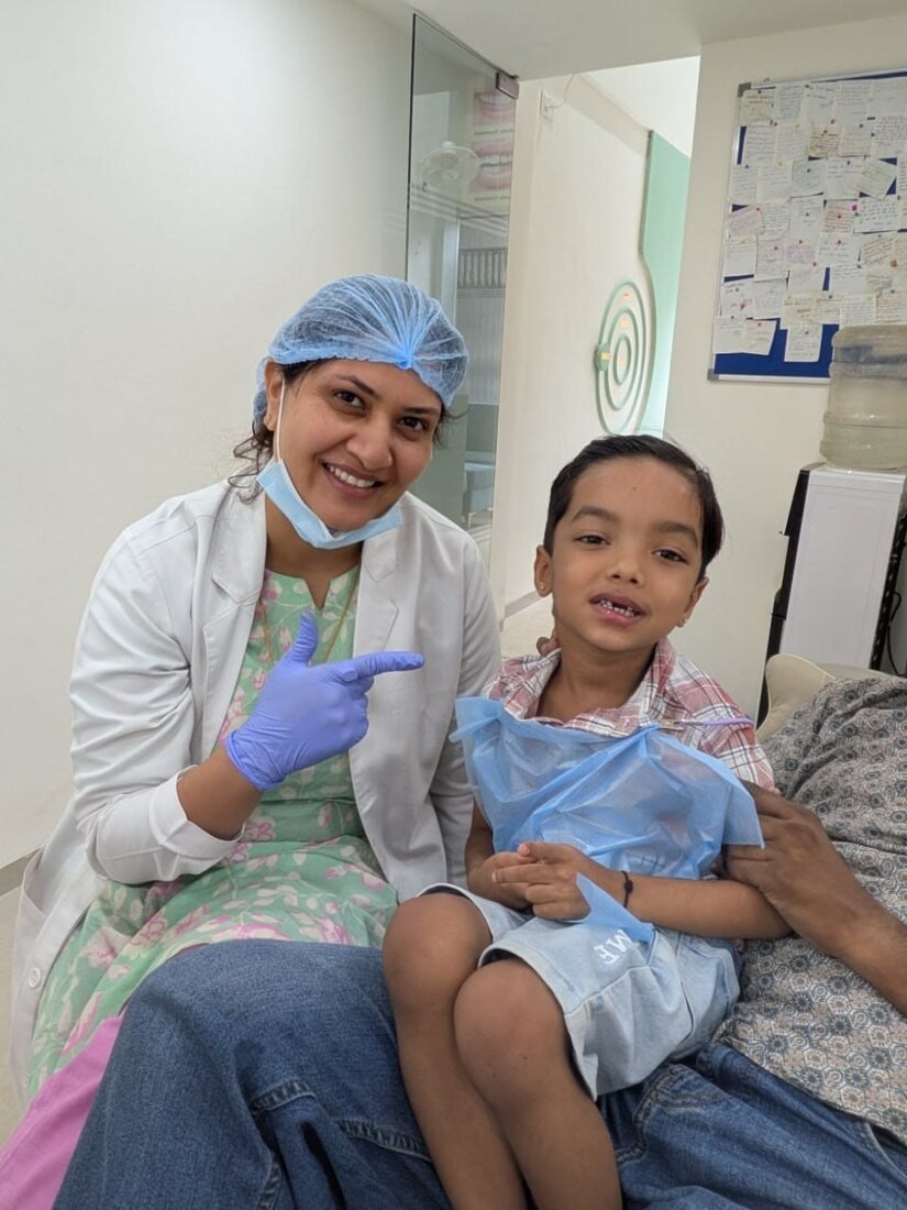 Happy young patient with the dentist