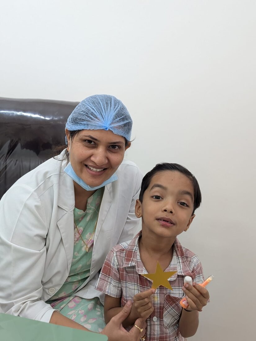 Smiling child patient with the doctor